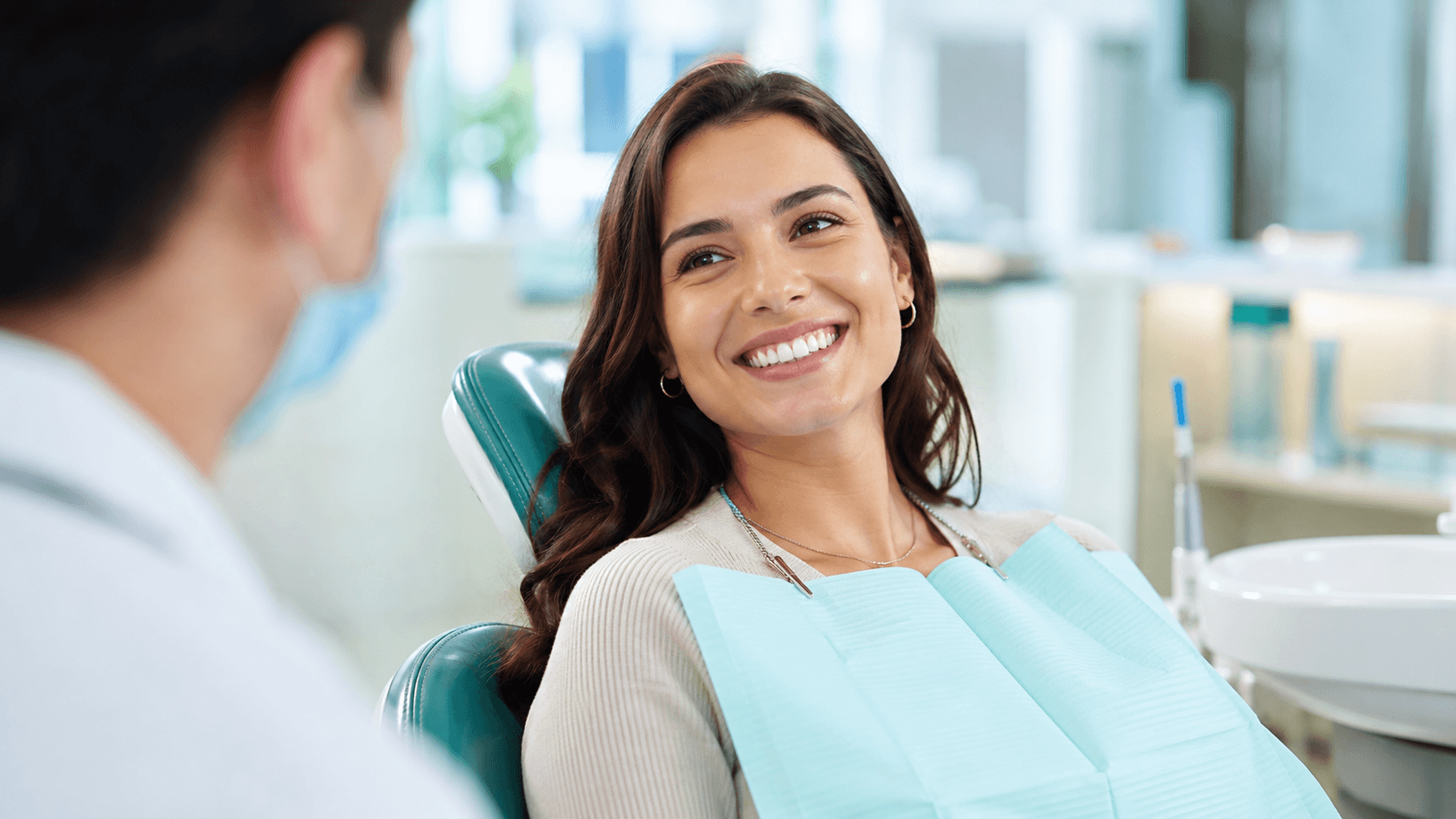 A smiling foreign patient at an English-speaking dental clinic in Korea after a filling.