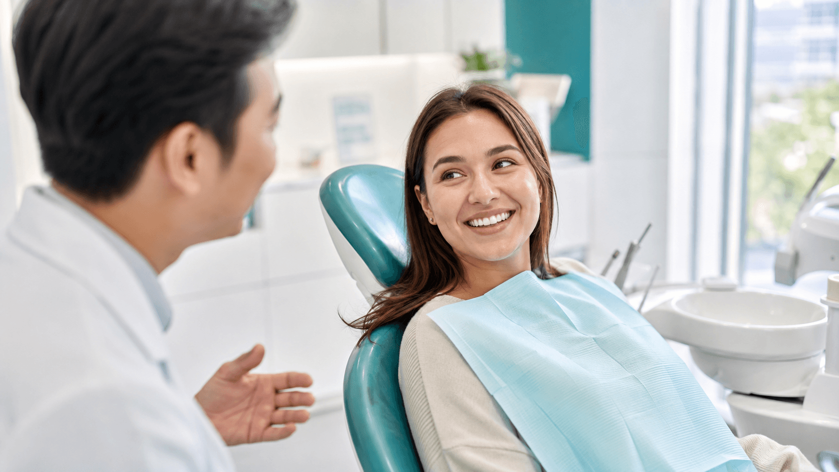 A foreign resident reviewing a dental estimate and insurance details with an English-speaking dentist in Korea.